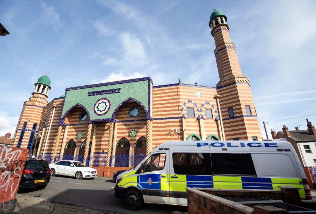 A police van outside Makkah Mosque in Leeds (PA)