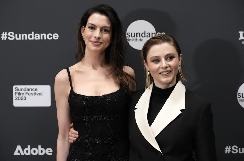 Anne Hathaway, left, and Thomas McKenzie, cast members in "Eileen," pose together at the premiere of the film at the 2023 Sundance Film Festival, Saturday, Jan. 21, 2023, in Park City, Utah. (AP Photo/Chris Pizzello)