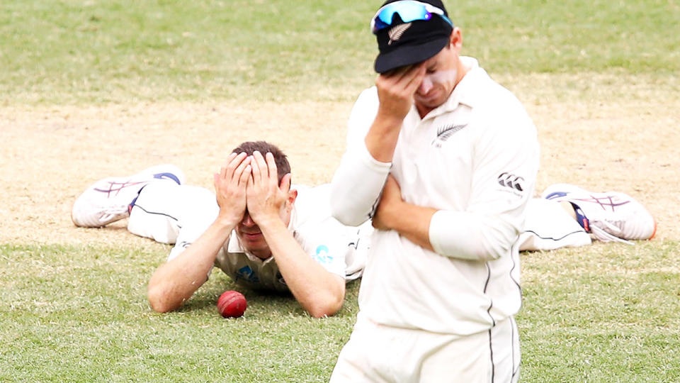 Todd Astle and Tom Latham, pictured here reacting to the shocking dropped catch.