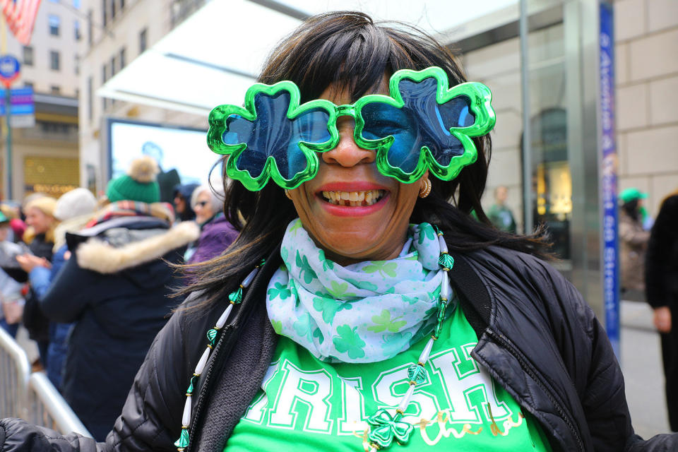 A woman shows off her shamrock eyewear  along Fifth Ave. during the St. Patrick's Day Parade; March 16, 2019 in New York. (Photo: Gordon Donovan/Yahoo News) 