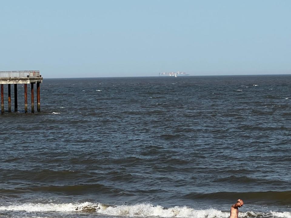 A large container ship on the horizon off the coast of Southwold, Suffolk (The Independent)