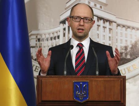 Ukraine's Prime Minister Arseny Yatseniuk addresses the media duringa news briefing in Kiev March 11, 2015. REUTERS/Valentyn Ogirenko