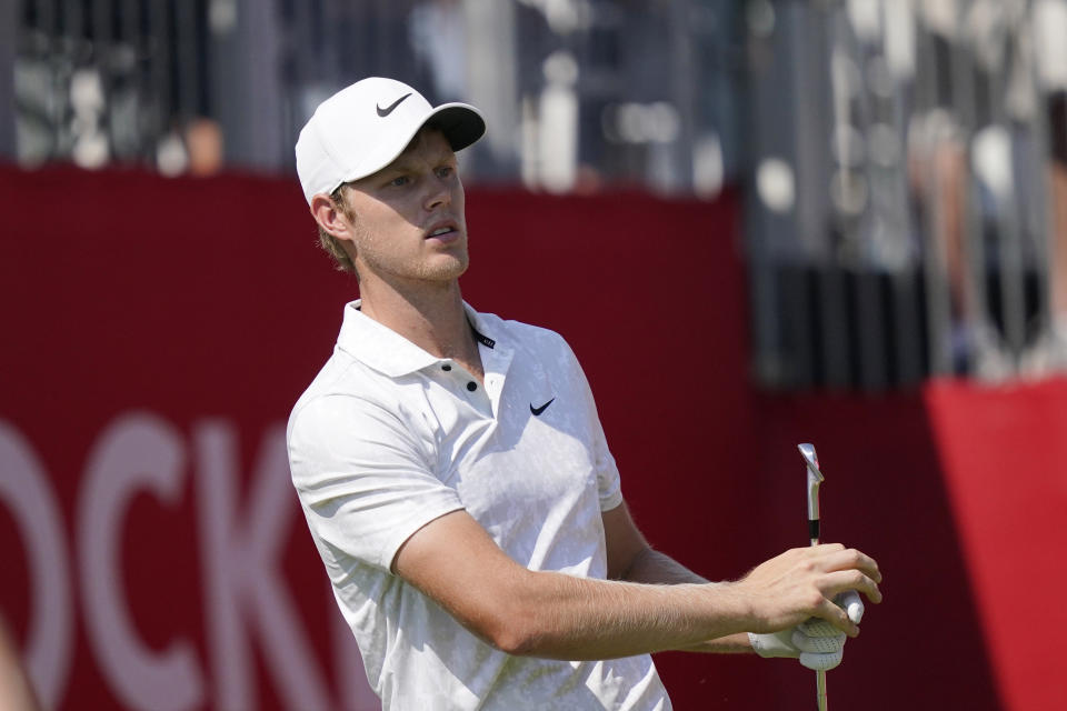 Cam Davis watches his drive off the 15th tee during the third round of the Rocket Mortgage Classic golf tournament, Saturday, July 3, 2021, at the Detroit Golf Club in Detroit. (AP Photo/Carlos Osorio)