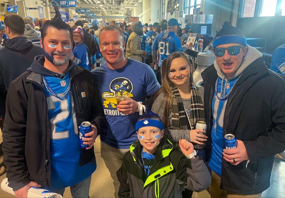 James Morningstar, 27, his nephew Gavin, 7, and his brother Jacob, 33, dyed their hair blue and shaped it into mohawks for the game. It's the first game ever for Jacob and Gavin, who came up from Kentucky for the experience. "I feel like there's helium inside of me," Jacob said.