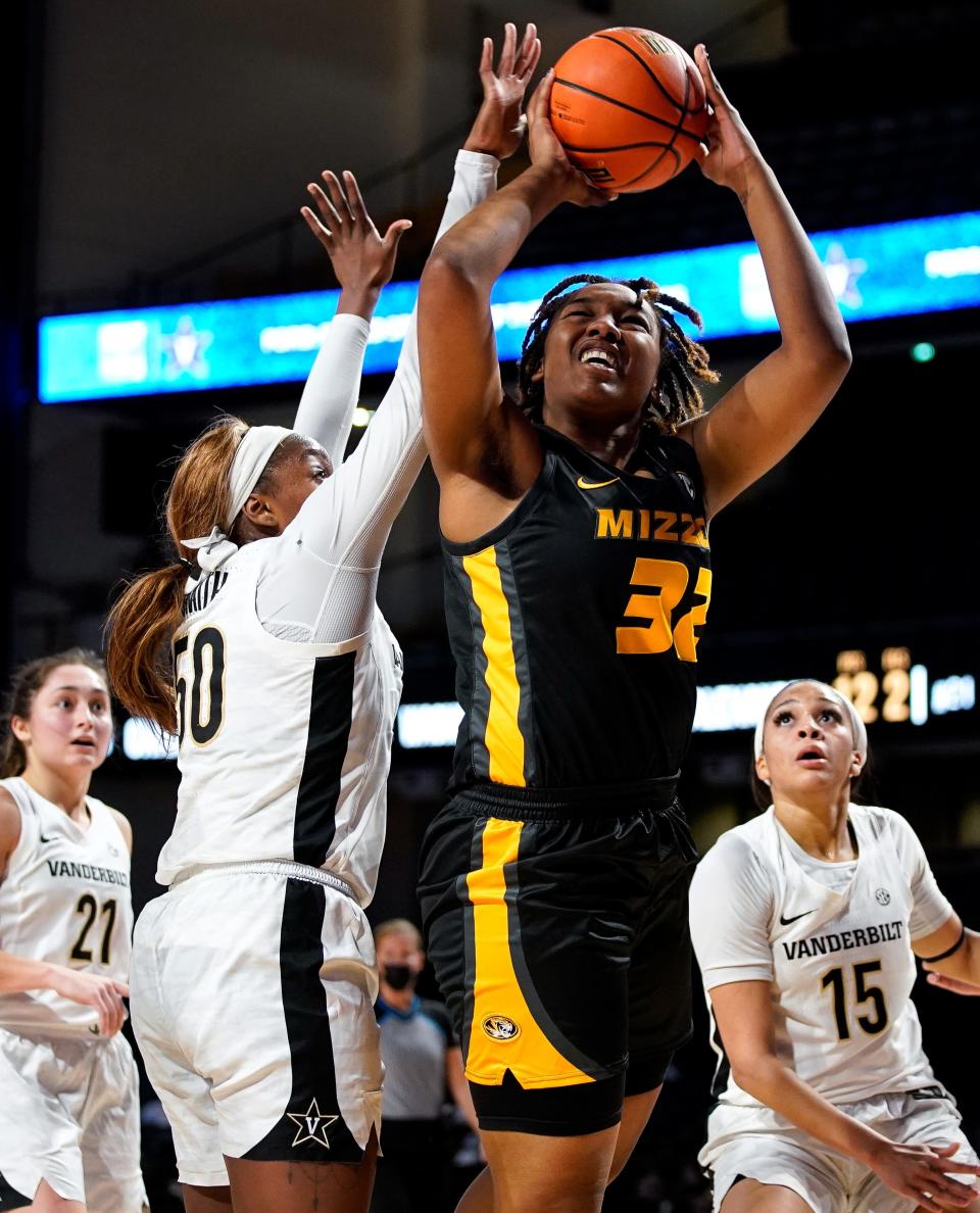 Missouri center Jayla Kelly (32) shoots past Vanderbilt forward Kaylon Smith (50) during the third quarter Thursday at Memorial Gym in Nashville, Tenn.