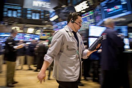 Traders work on the floor of the New York Stock Exchange April 17, 2015. REUTERS/Brendan McDermid