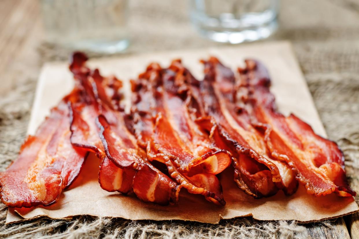 Bacon on a piece of brown paper on a table