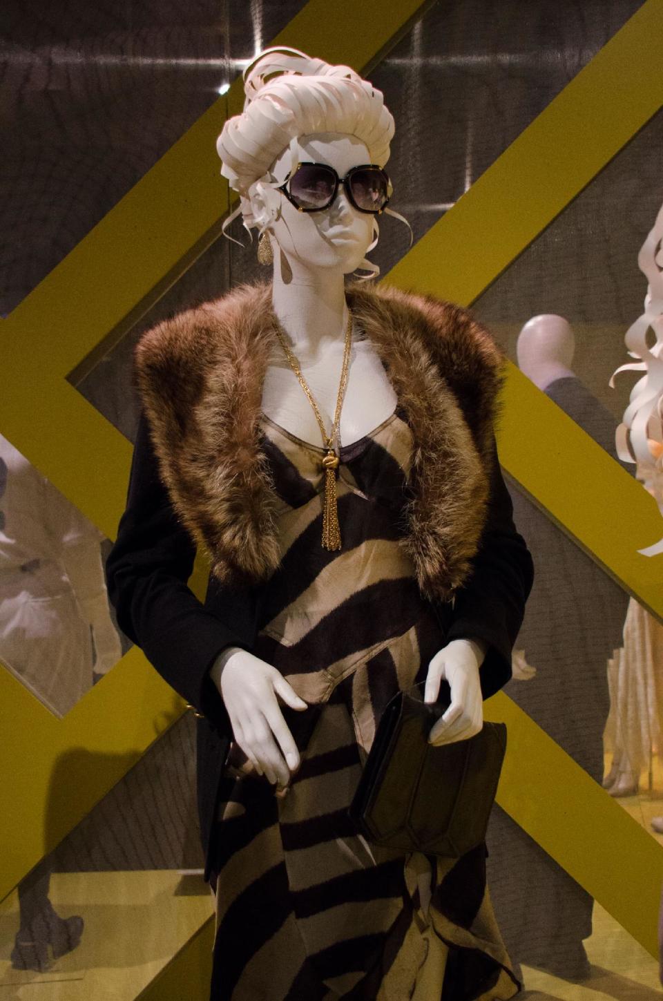 In this Saturday, Feb. 8, 2014 photo, 2014 Oscar nominated costumes for "American Hustle," by costume designer Michael Wilkinson are on display at the 22nd annual Art of Motion Picture Costume Design Exhibit, in Los Angeles, Calif. The Fashion Institute of Design & Merchandising holds its free-to-the-public Art of Motion Picture Costume Design exhibit on view until April 26, 2014, featuring this year's five Oscar nominees: "American Hustle," "The Grandmaster," "The Great Gatsby," "The Invisible Woman" and "12 Years A Slave," in Los Angeles. (Photo by Tonya Wise/Invision/AP)