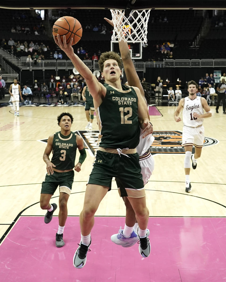 Colorado State forward Patrick Cartier (12) puts up a shot during the second half of an NCAA college basketball game against Boston College Wednesday, Nov. 22, 2023, in Kansas City, Mo. Colorado State won 86-74. (AP Photo/Charlie Riedel)