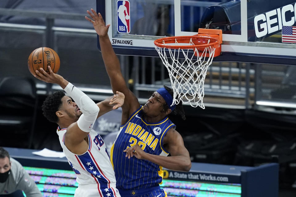 Philadelphia 76ers' Tobias Harris, front left, shoots against Indiana Pacers' Myles Turner (33) during the first half of an NBA basketball game, Sunday, Jan. 31, 2021, in Indianapolis. (AP Photo/Darron Cummings)