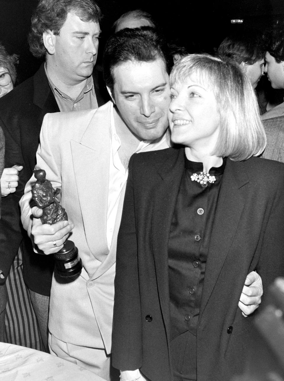 Freddie Mercury, with girlfriend Mary Austin, at the Ivor Novello Awards in May 1987 where Queen won the award for Outstanding Contribution to British Music (Photo by Dave Hogan/Hulton Archive/Getty Images)