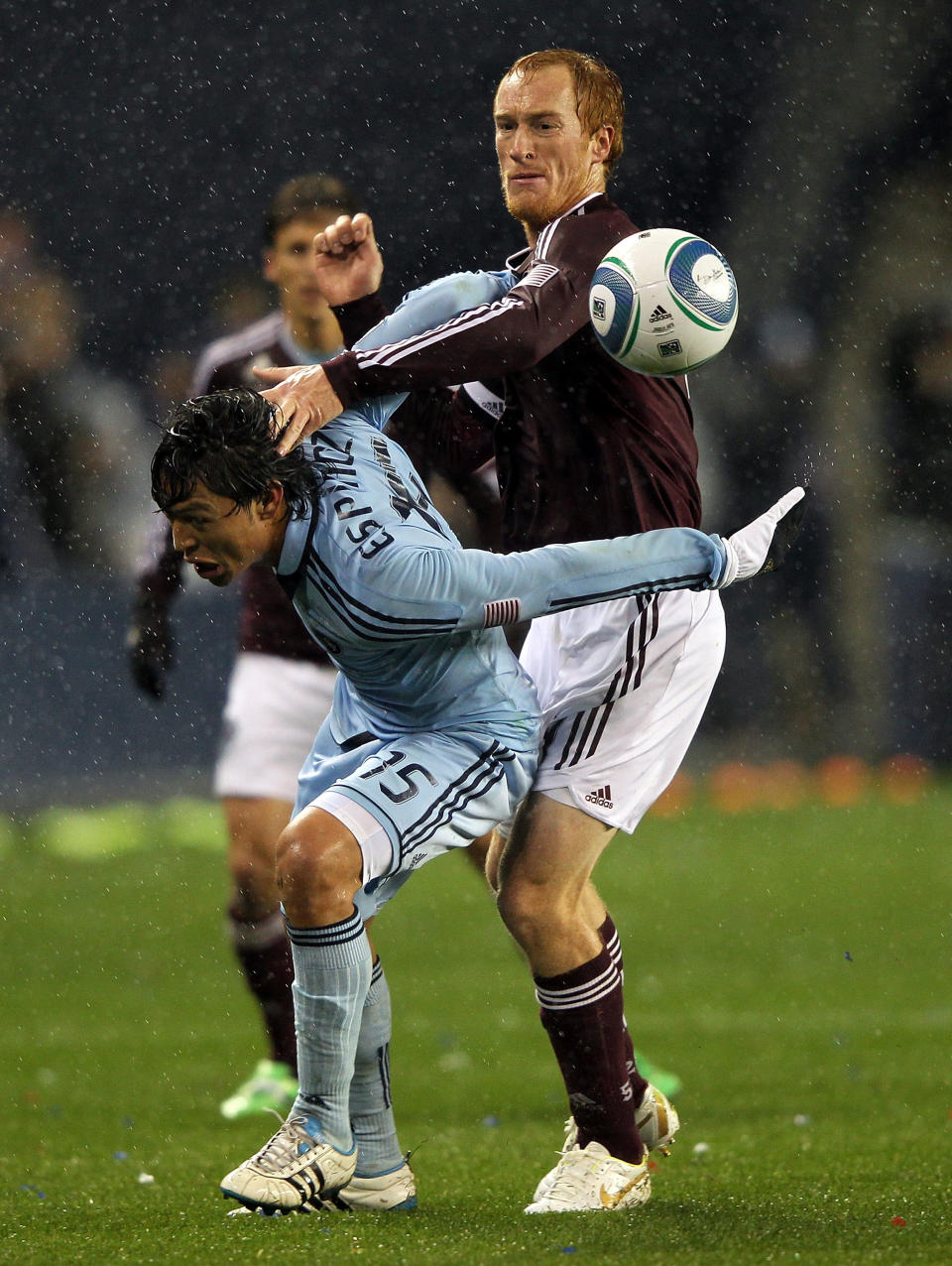 KANSAS CITY, KS - NOVEMBER 02: Jeff Larentowicz #4 of the Colorado Rapids battles Roger Espinoza #15 of Sporting Kansas City for the ball during the MLS playoff game on November 2, 2011 at LiveStrong Sporting Park in Kansas City, Kansas. (Photo by Jamie Squire/Getty Images)