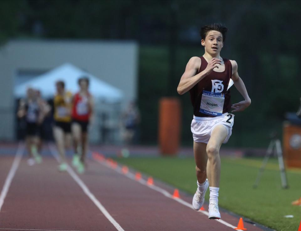 Fordham Prep's Myles Hogan wins the 3200-meter run during Day 2 of the Loucks Games track and field meet at White Plains High School on Friday, May 13, 2022.