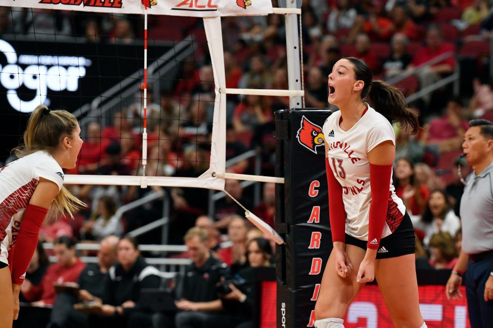 Louisville's Cara Cresse (13) reacts after scoring during the fourth game of the Cardinals' match against Stanford, Sunday, Sept. 17, 2023, in Louisville Ky. Louisville lost to Stanford 3-2.