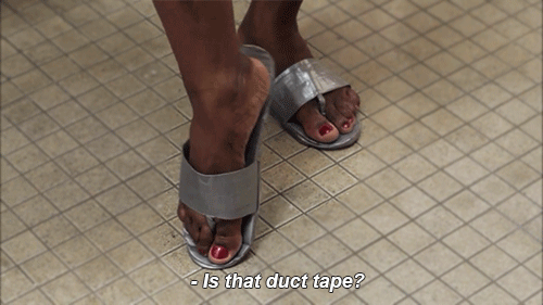 <strong><em>duc-tay-p</em> (noun)</strong>  Not just for taping up wires and 'Fifty Shades Of Grey' fun, duct tape can also help you fashion a fetching pair of prison sandals, modeled here by the incomparable Laverne Cox.