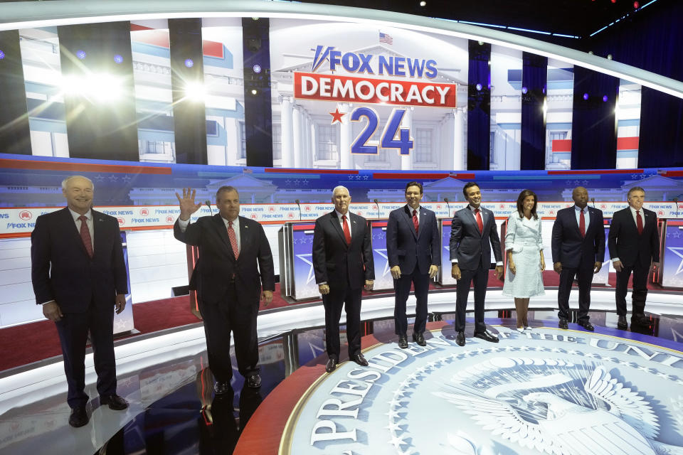 FILE - Republican presidential candidates, from left, former Arkansas Gov. Asa Hutchinson, former New Jersey Gov. Chris Christie, former Vice President Mike Pence, Florida Gov. Ron DeSantis, businessman Vivek Ramaswamy, former U.N. Ambassador Nikki Haley, Sen. Tim Scott, R-S.C., and North Dakota Gov. Doug Burgum stand on stage before a Republican presidential primary debate hosted by FOX News Channel Wednesday, Aug. 23, 2023, in Milwaukee. (AP Photo/Morry Gash, File)