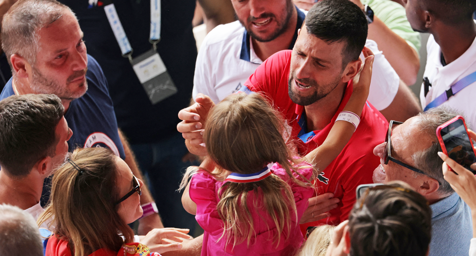 Novak Djokovic celebrates his Olympic Games gold medal with his family. Pic: Getty 