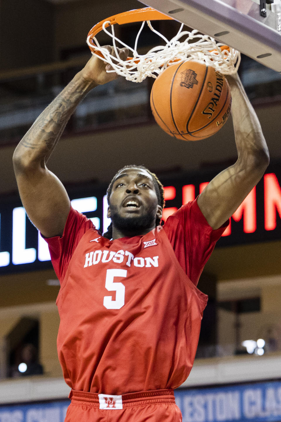 Houston's Ja'Vier Francis dunks against Towson during the first half of an NCAA college basketball game in the Charleston Classic in Charleston, S.C., Thursday, Nov. 16, 2023. (AP Photo/Mic Smith)
