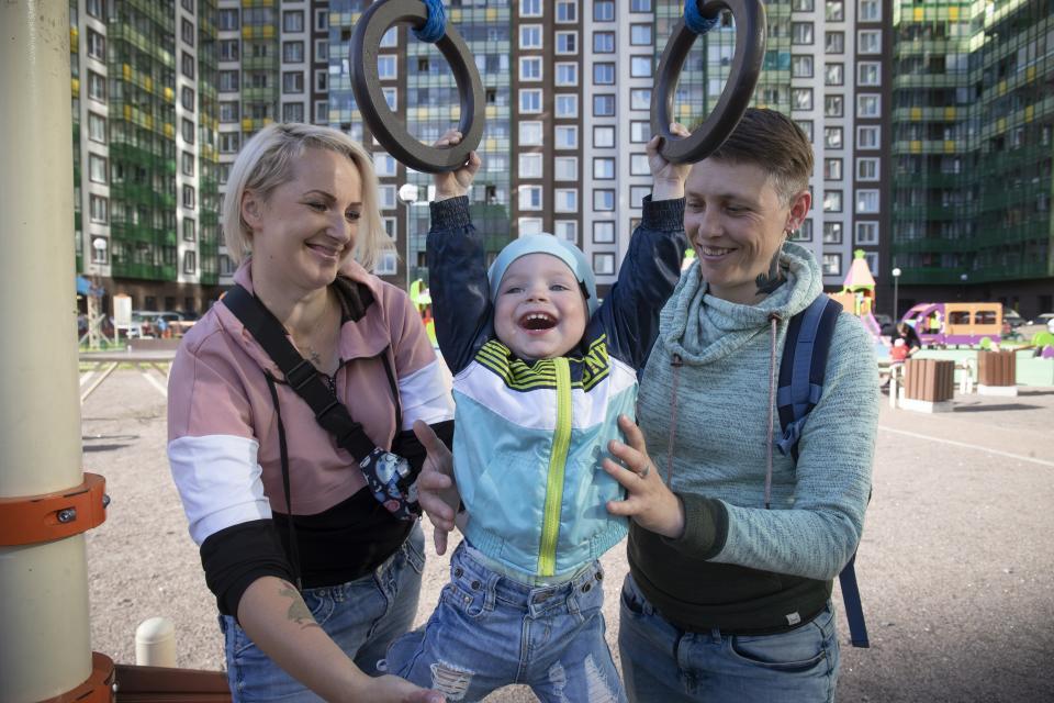 Irina, right, and Anastasia Lagutenko play with their son, Dorian, at a playground in St. Petersburg, Russia, July 2, 2020. Their 2017 wedding wasn’t legally recognized in Russia. Any hopes they could someday officially be married in their homeland vanished July 1 when voters approved a package of constitutional amendments, one of which stipulates that marriage in Russia is only between a man and a woman. (AP Photo)