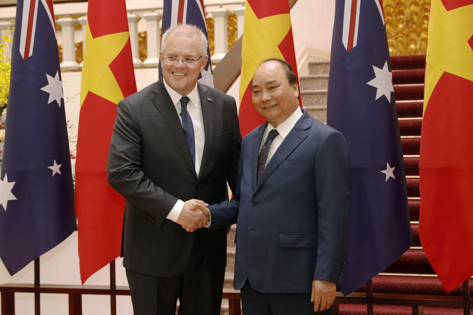 Australian Prime Minister Scott Morrison, left, and his Vietnamese counterpart Nguyen Xuan Phuc pose for a photo during a welcome ceremony at the Presidential Palace in Hanoi, Vietnam, Friday, Aug. 23, 2019. Morrison is on a three-day official visit to Vietnam. (AP Photo/Duc Thanh)