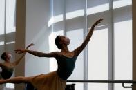 Shanghai Ballet dancers wearing masks practise in a dance studio in Shanghai