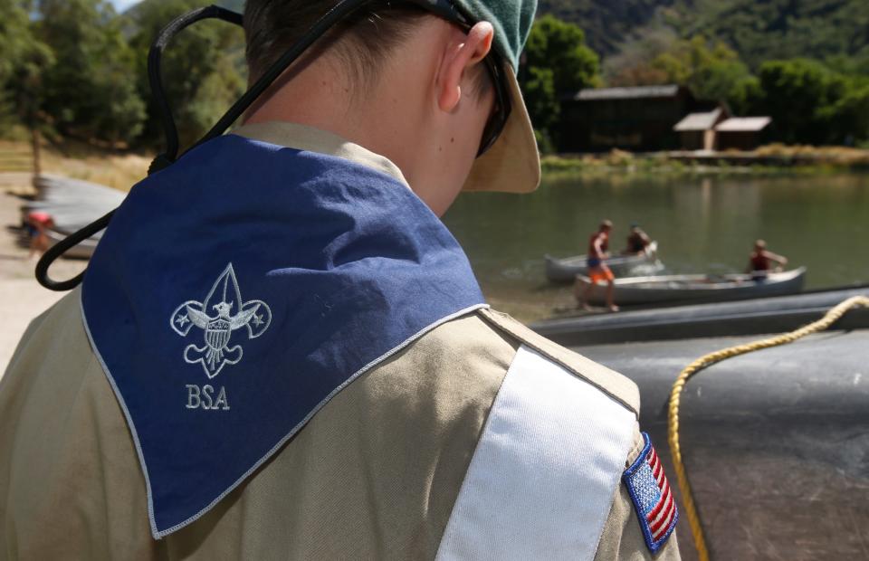 A Boy Scout works on a canoe at camp Maple Dell on July 31, 2015 outside Payson, Utah.