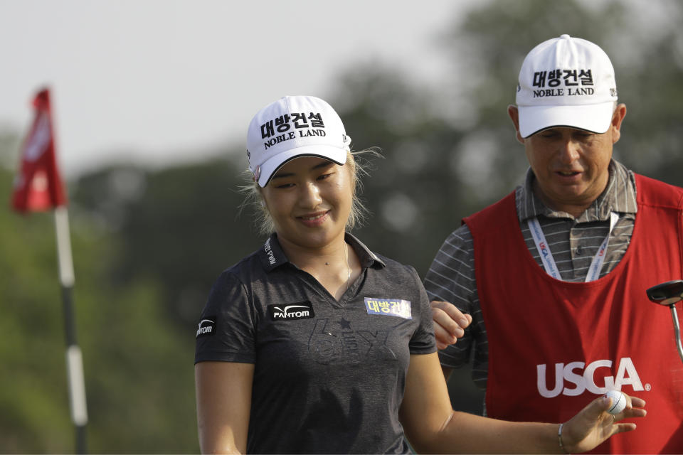 Jeongeun Lee6 of South Korea, leaves the 18th green during the final round of the U.S. Women's Open golf tournament, Sunday, June 2, 2019, in Charleston, S.C. Lee6 wins the tournament. (AP Photo/Steve Helber)