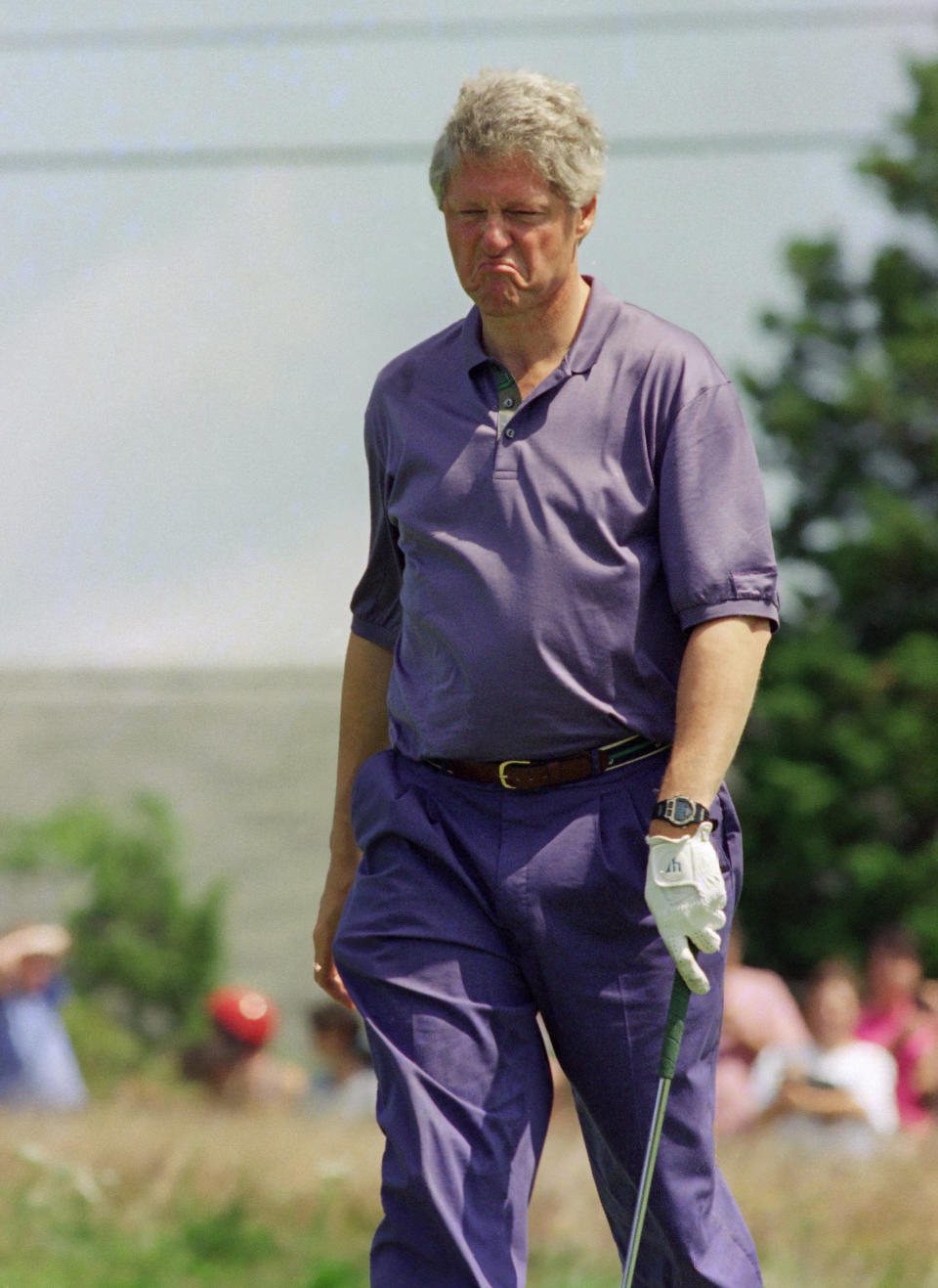 Why the sad face? President Clinton misses a putt on his first day of vacation in Martha's Vineyard in August 1993. 