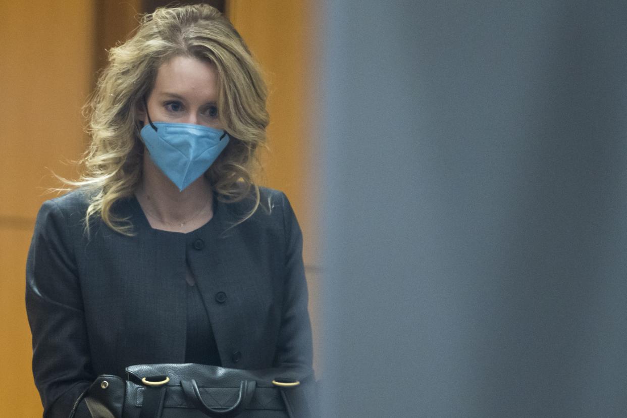 Elizabeth Holmes walks into federal court in San Jose, Calif., Monday, Jan. 3, 2022. 