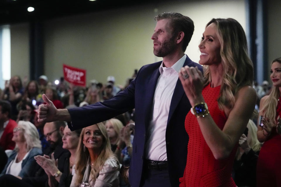 FILE - Eric and Lara Trump stand as Republican presidential candidate former President Donald Trump speaks Wednesday, Oct. 11, 2023, at Palm Beach County Convention Center in West Palm Beach, Fla. (AP Photo/Rebecca Blackwell, File)