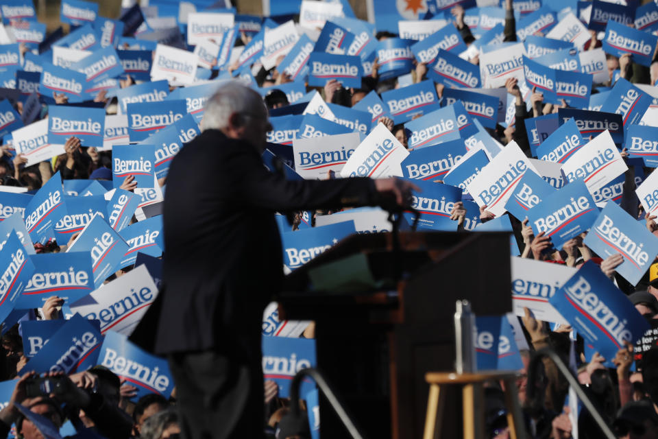 Supporters of Democratic presidential candidate Sen. Bernie Sanders, I-Vt., wave their campaign signs at a rally in Chicago's Grant Park Saturday, March 7, 2020. (AP Photo/Charles Rex Arbogast)