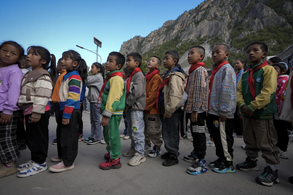 Tibetan students line up to enter a canteen for their meals at the Shangri-La Key Boarding School during a media-organized tour in Dabpa county, Kardze Prefecture, Sichuan province, China on Sept. 5, 2023. (AP Photo/Andy Wong)