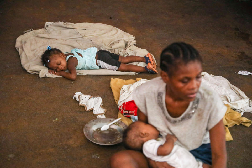A child sleeps at a shelter housing people who fled their homes due to gang violence in Port-au-Prince Haiti, Monday, May 27, 2024. (AP Photo/Odelyn Joseph)