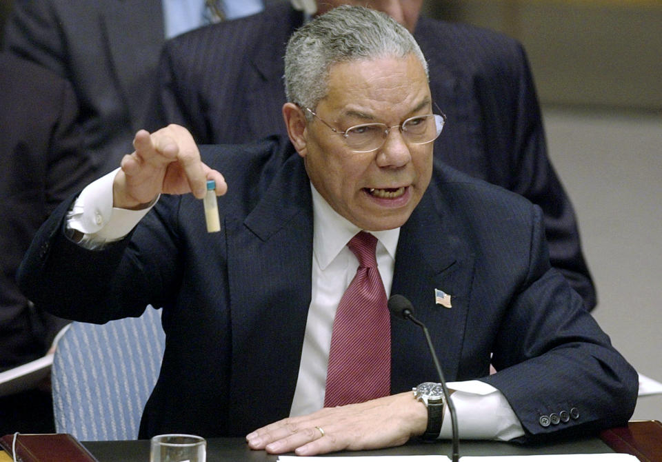 FILE - In this Feb. 5, 2003 file photo, Secretary of State Colin Powell holds up a vial he said could contain anthrax as he presents evidence of Iraq's alleged weapons programs to the United Nations Security Council. Powell, former Joint Chiefs chairman and secretary of state, has died from COVID-19 complications. In an announcement on social media Monday, the family said Powell had been fully vaccinated. He was 84. (AP Photo/Elise Amendola, File)