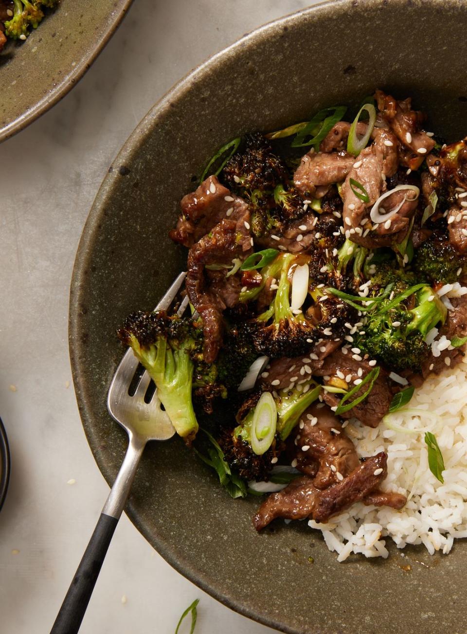 air fryer beef and broccoli in a bowl with white rice