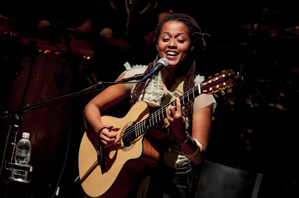 Afro-Portuguese musician Sara Tavares plays guitar as she performs, with her band, during the World Music Institute/Carnegie Hall's 'Between Portugal and Cape Verde' concert at Carnegie Hall's Zankel Hall, New York, New York, November 13, 2009. (Photo by Jack Vartoogian/Getty Images)