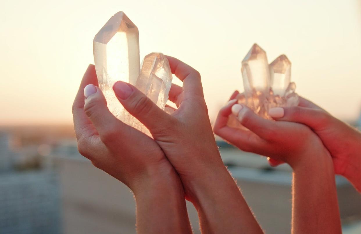 Proponents claim the stones can promote health and well-being. <a href="https://www.gettyimages.com/detail/photo/sisters-meditating-with-healing-crystals-rooftop-royalty-free-image/1280567102?adppopup=true" rel="nofollow noopener" target="_blank" data-ylk="slk:janiecbros/Getty Images;elm:context_link;itc:0;sec:content-canvas" class="link ">janiecbros/Getty Images</a>