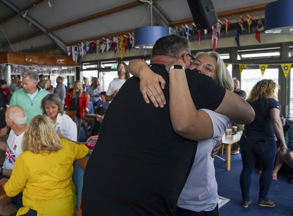 Eilidh McIntyre’s friends and family celebrate her win at Hayling Island Sailing Club, Hampshire (Steve Parsons/PA) (PA Wire)