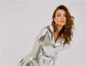 <p>Emily Ratajkowski wears the white jelly hoops with a metallic trench coat for the Loucite by Alison Lou campaign. (Photo: Jacqueline Harriet / courtesy of Alison Lou) </p>