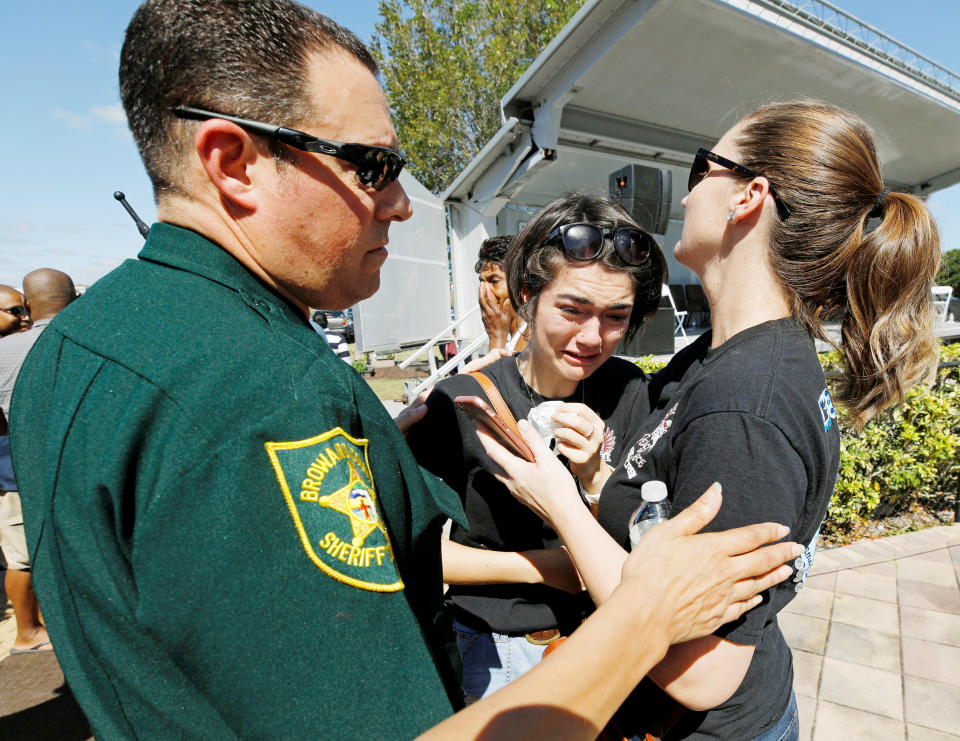 A mother tries to comfort her weeping daughter at the end of&nbsp;the vigil.&nbsp;