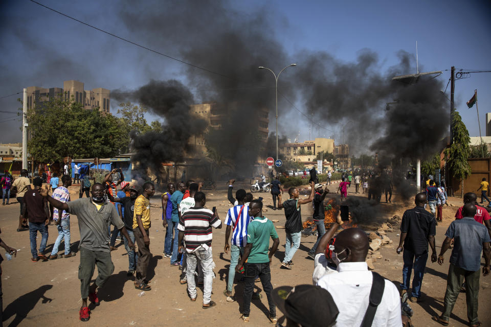 Protestors take to the streets of Burkina Faso's capital Ouagadougou Saturday Nov. 27, 2021, calling for President Roch Marc Christian Kabore to resign. The protest comes after the deadliest attack in years against the security forces in the Sahel's Soum province earlier this month, where more than 50 security forces were killed and after an attack in the Center North region where 19 people including nine members of the security forces were killed. (AP Photo/Sophie Garcia)