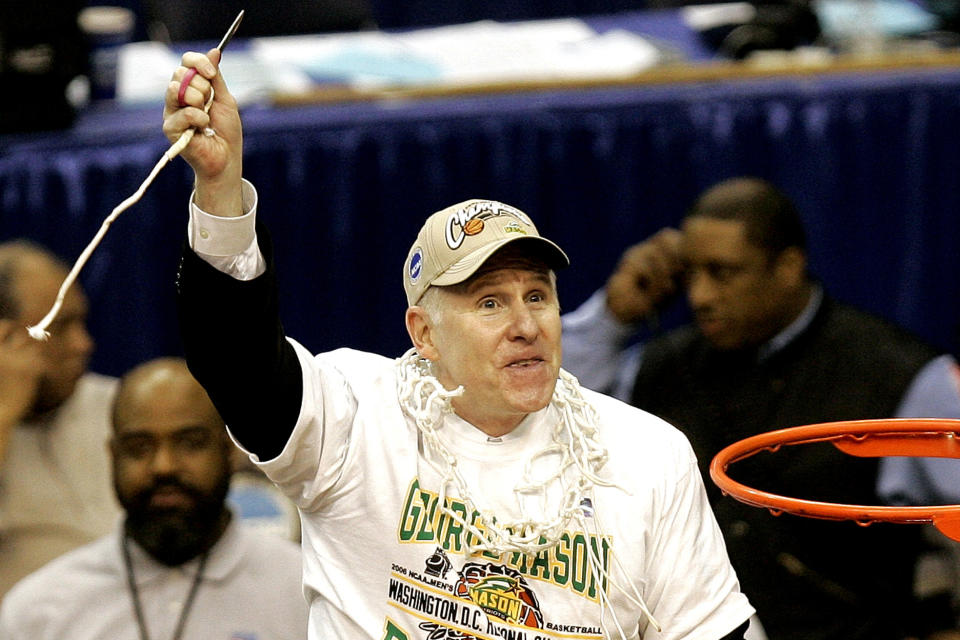 FILE - In this March 25, 2006, file photo, George Mason head coach Jim Larranaga finishes cutting the net after beating Connecticut 86-84 in overtime during the fourth round of the NCAA basketball tournament in Washington. (AP Photo/Susan Walsh, File)