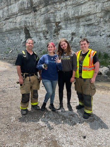 Myers Hart and his high school sweetheart, Brooklynn Stevens, with firefighters from Williamson Fire Rescue. (Photo: Williamson County Sheriff's Office)