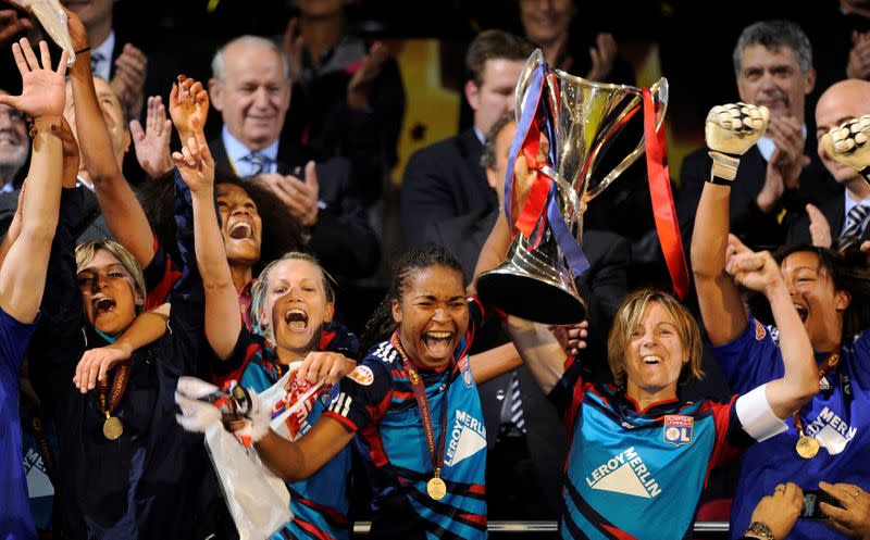 FILE PHOTO: Olympique Lyonnais players celebrate after sealing a 2-0 victory over Germany's FCC Turbine Potsdam in the Women's Champions League final at Craven Cottage, London.