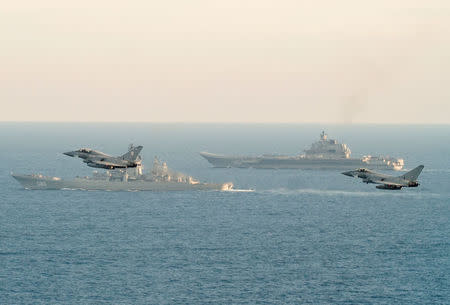 RAF Typhoons monitor Russian warships Pyotr Velikiy and the Admiral Kuznetsov (rear) as they pass close to UK territorial waters, in this photograph released in London on January 25, 2017. Ministry of Defence/Crown Copyright 2017/Handout via REUTERS