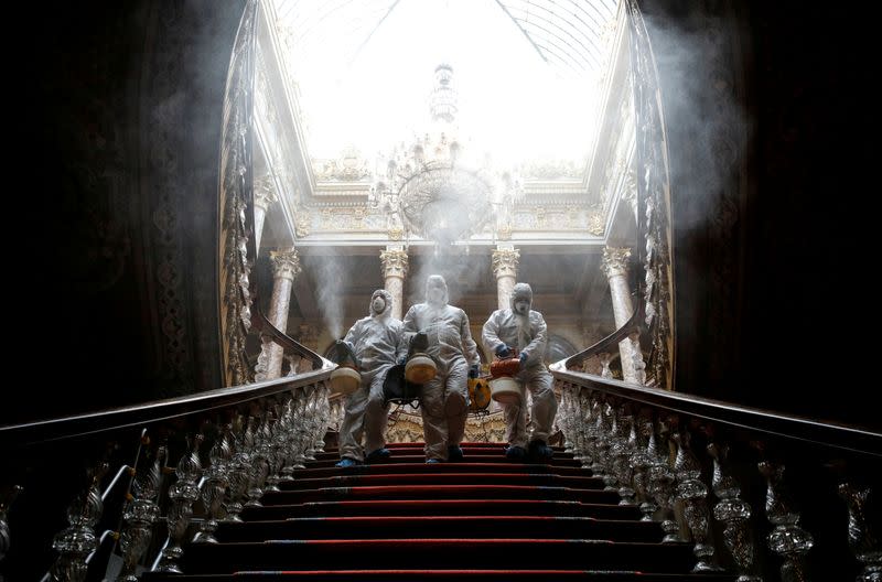 FILE PHOTO: Workers in protective suits disinfect Dolmabahce Palace due to coronavirus concerns in Istanbul