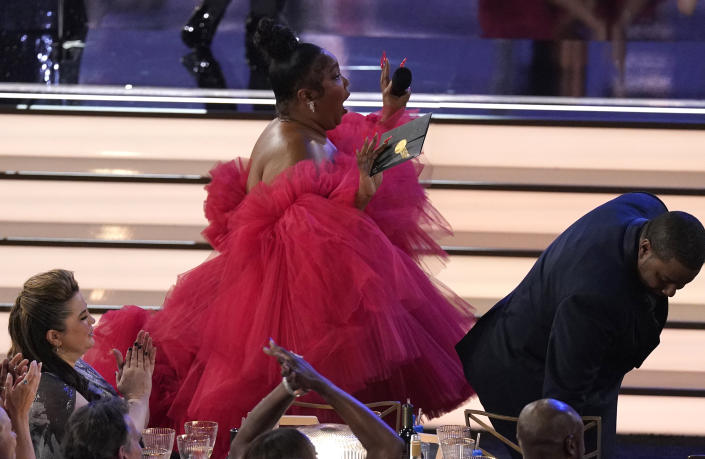 Lizzo reacts to Sheryl Lee Ralph winning the Emmy for outstanding supporting actress in a comedy series for "Abbott Elementary" at the 74th Primetime Emmy Awards on Monday, Sept. 12, 2022, at the Microsoft Theater in Los Angeles. (AP Photo/Mark Terrill)