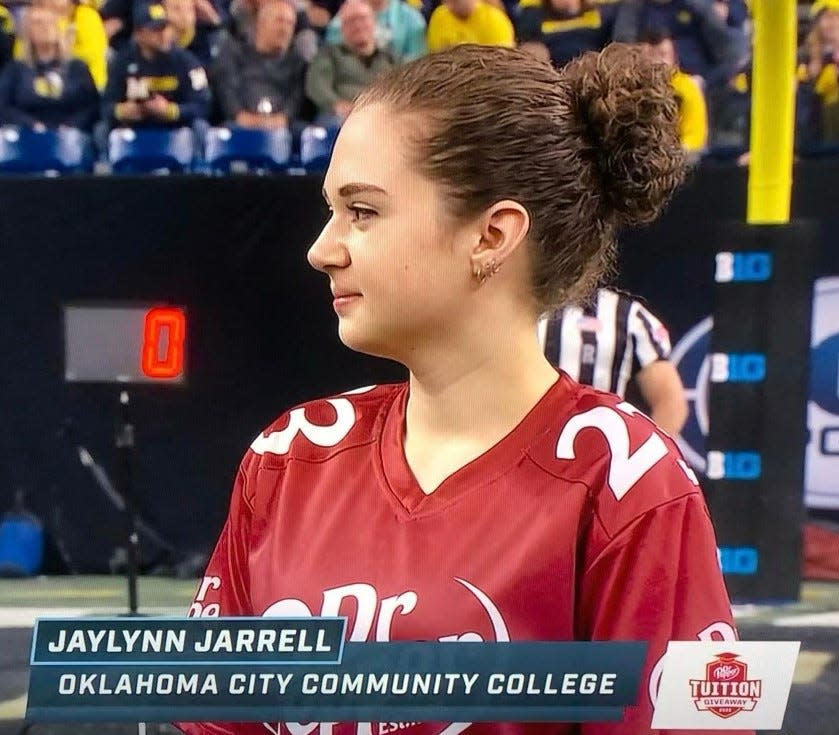 Oklahoma City Community College engineering student Jaylynn Jarrell won $100,000 in the 2022 Dr Pepper Tuition Giveaway during the halftime show at the Big Ten Championship game.