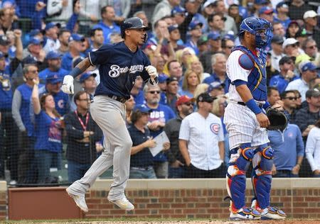 Oct 1, 2018; Chicago, IL, USA; Milwaukee Brewers shortstop Orlando Arcia (3) scores in the eighth inning against the Chicago Cubs in the National League Central division tiebreaker game at Wrigley Field. Mandatory Credit: Patrick Gorski-USA TODAY Sports