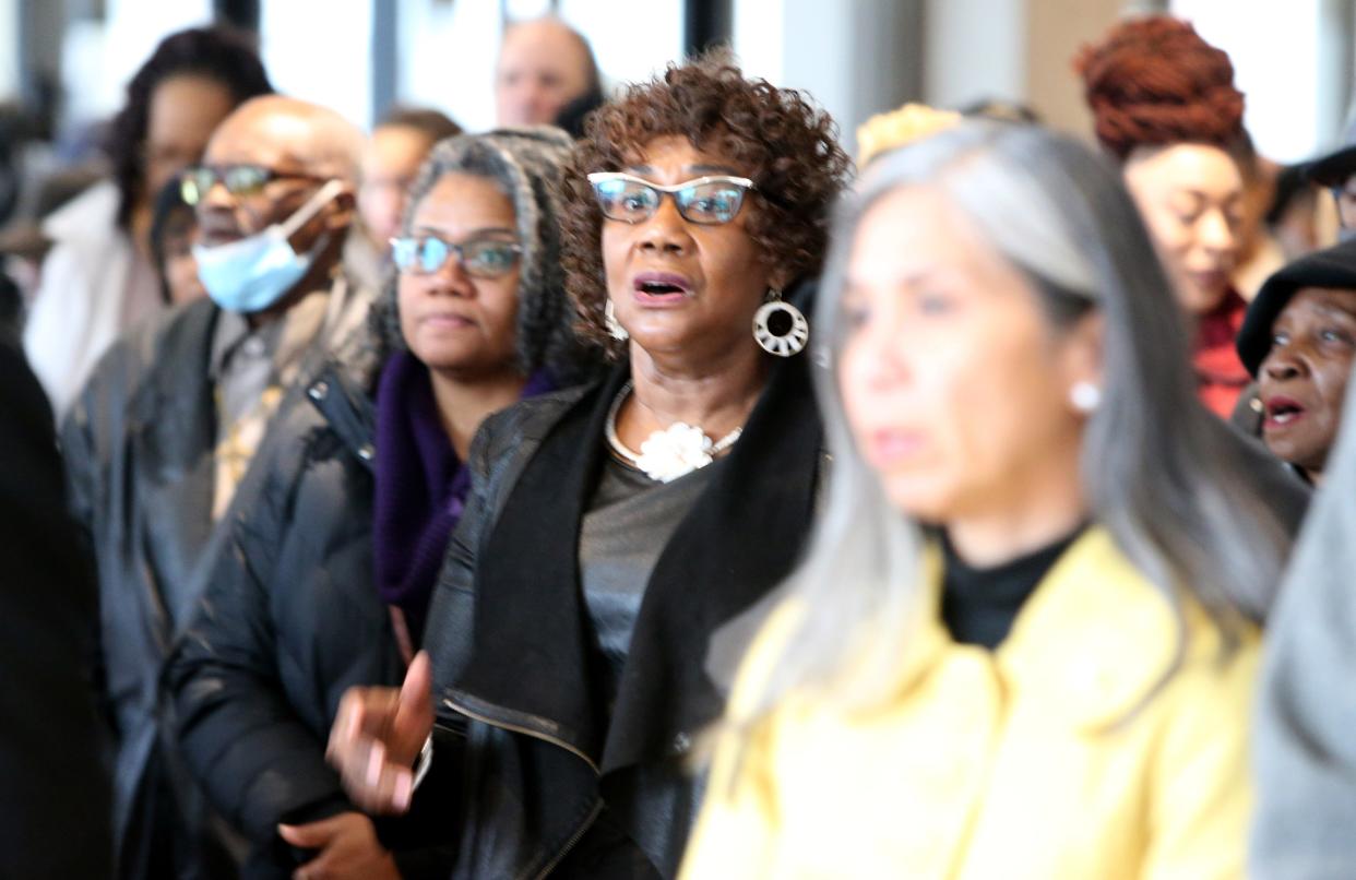 Participants sing “Lift Every Voice and Sing” in the County-City Building before the annual march to mark Martin Luther King Jr. Day in South Bend in 2023.